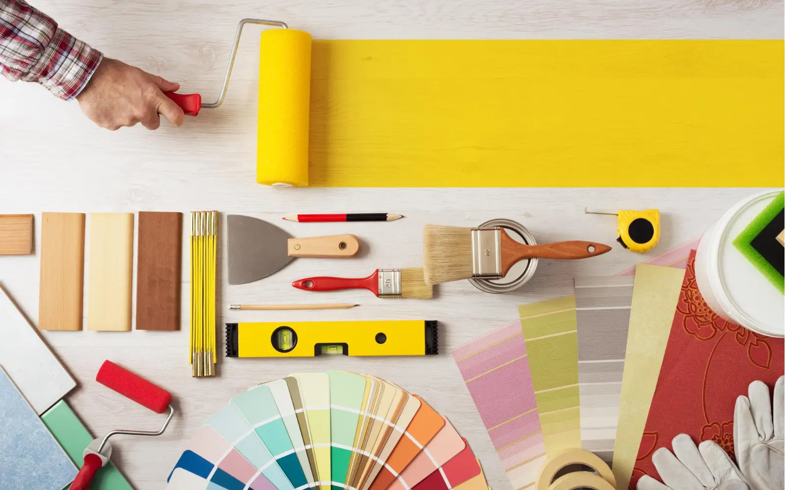 Tools and color palettes for home renovation projects, showcasing materials and equipment for cost-effective house remodeling