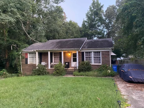 Cozy suburban house with illuminated porch lights